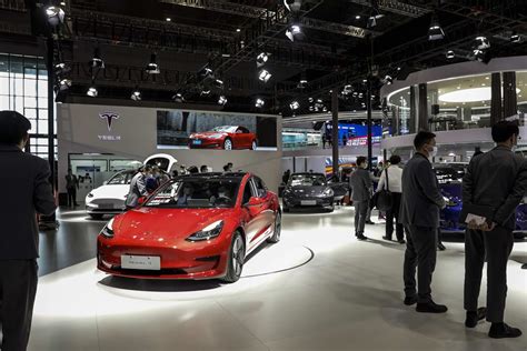 Woman detained for protesting Tesla at Shanghai auto show.